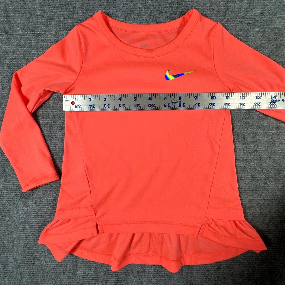 Nike Kids Dri-FIT Long Sleeve Peplum Ruffle Top Coral Pink Iridescent Swoosh